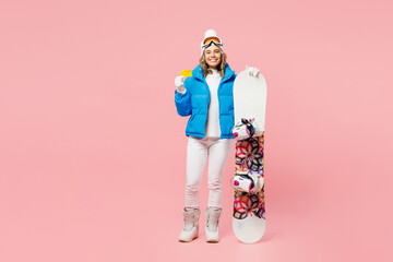 Snowboarder woman fun wearing blue suit goggles mask hat ski padded jacket hold mock up credit bank...