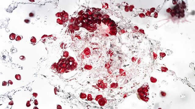 Slow Motion of Explosion Pomegranate Seeds and Burst Water
