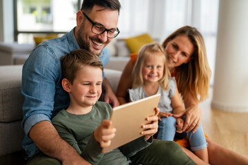 Device technology family online education concept. Happy family with digital devices at home.