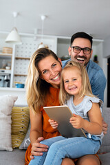 Device technology family online education concept. Happy family with digital devices at home.