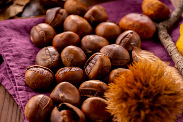 Chestnuts on a wooden table.
Tasty chestnuts image.