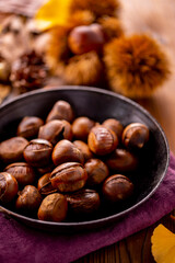 Chestnuts on a wooden table.
Tasty chestnuts image.