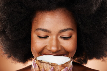 Closeup beauty, coconut and black woman in studio with skincare, healthy glow and smile on face....