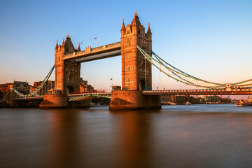 Tower Bridge over river Thames in London, England at sunset