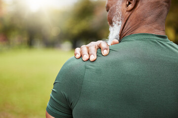 Shoulder, pain and injury with a senior black man holding his joint, sore with inflammation outdoor...