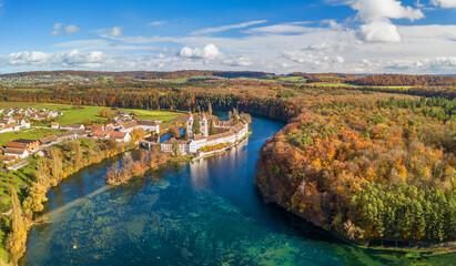 Aerial panorama view of the Rheinau Abbey Islet on Rhine river in autumnal splendid colors,...