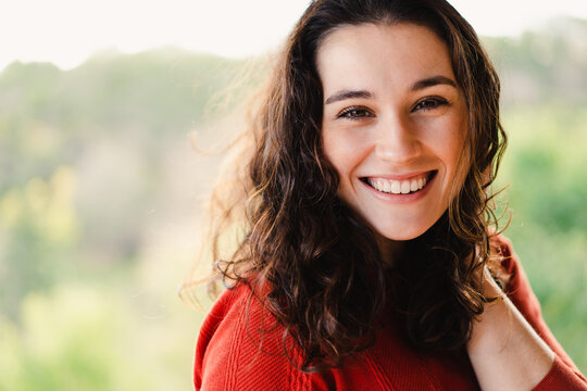 Portrait of a beautiful young woman with a healthy smile outdoor