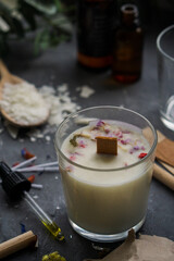 Scented candle in glass with wooden wick. Set for crafting natural eco soy wax candle. 