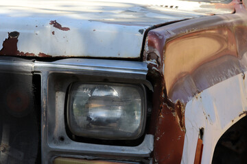 antique car abandoned to rot