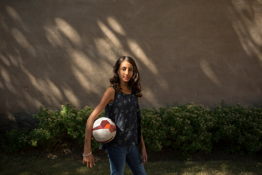 Portrait of girl holding ball