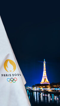 PARIS, FRANCE: Summer olympic game Paris 2024 black background. Official logo 2024 in Paris on white blanket dark Eiffel Tower in night. Black edit space, Vertical ratio 16:9 for smartphone.