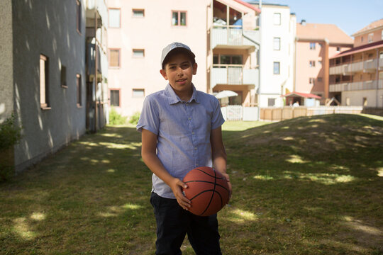 Portrait of boy holding basketball