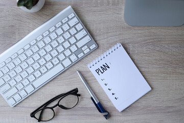 New year notebook plan on desk. Resolutions, plan, goals, action, checklist, idea concept. 