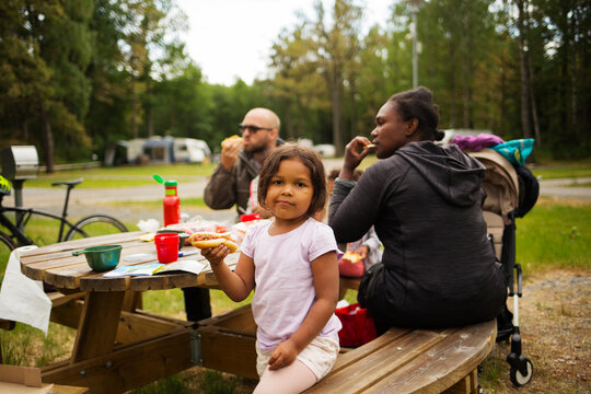Family eating at picnic table