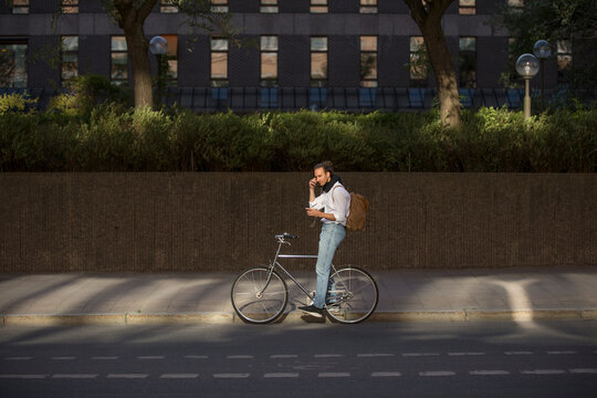 Man listening to music on bicycle
