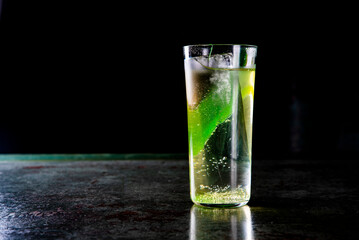 gin tonic cocktail glass on black background