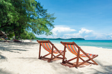 chairs near the water on a sandy beach. Concept for a summer vacation and holiday in tourism. beautiful tropical scenery, Beautiful beach.