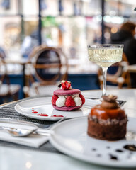 Raspberry cake and a cocktail in a restaurant