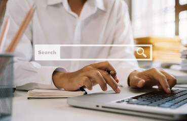 Search bar of internet browser and businessman working on modern laptop at table indoors, closeup in the office.