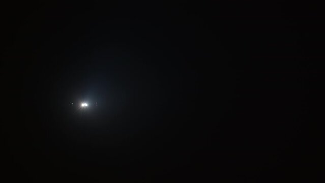 Airplane lights in the night sky