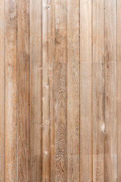 New modern brown wooden fence panel background with rough knotted grain timber texture, stock photo image