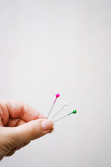 Conceptual image about choice with color pins against beige background