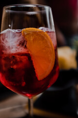 glass of campari drink with orange