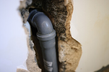 Water and drain pipe installation in wall.