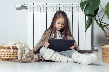 Relaxed little brunette long haired girl use electronic tablet, live streaming online, blogging,...