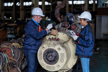 Maintenance manager and engineer checking part large engine supercharger prepare for overhaul repair