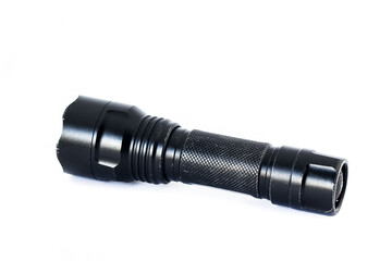 Black flashlight isolated on white background