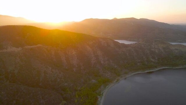 slow pan back of vail lake at sunset