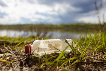 Abandoned garbage waste on nature. Environmental damage caused by human garbage pollution. Left...