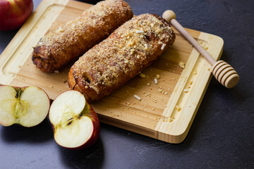 Homemade puff pastry roll with apple and walnuts. Puff pastry apple pastry for dessert
