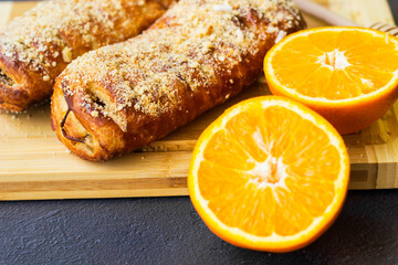 Tasty puff pastry roll with orange and walnuts