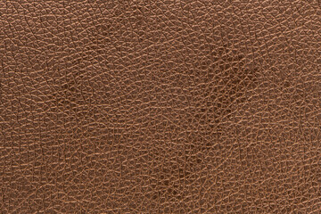 Brown bronze artificial or synthetic leather background with neat texture and copy space, colorful...