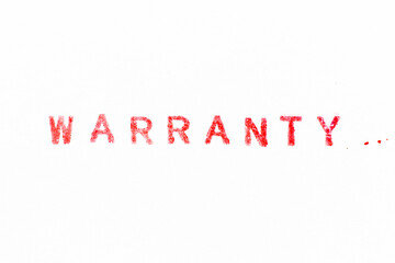 Red color ink rubber stamp in word warranty on white paper background