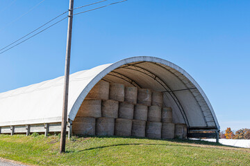 Round bales stored in hoop barn