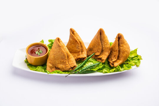 samosa or singara. Indian fried or baked pastry with a savory filling, spiced potatoes, onion, peas