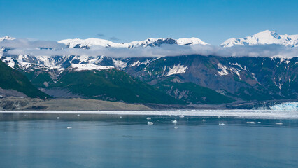 Fototapeta na wymiar Mountain glacier under blue sky nature scenery. Hubbard Glacier nature in Alaska, USA