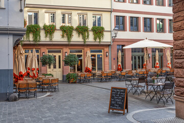 Frankfurt am Main, Germany - October 17th, 2022: Streets of Frankfurt am Main, beautiful city in Germany where modern and historic architecture meet. Street cafe.