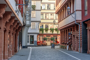 Frankfurt am Main, Germany - October 17th, 2022: Streets of Frankfurt am Main, beautiful city in Germany where modern and historic architecture meet. Street cafe.