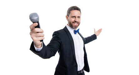 speaker man with microphone in selective focus. man speaker wear tuxedo in studio.
