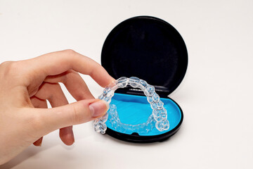 Transparent aligners and storage case. Invisible braces. Clear teeth straighteners. Plastic bracers