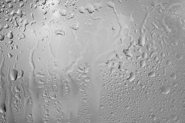 Raindrops. Wet surface. Glass in raindrops. 