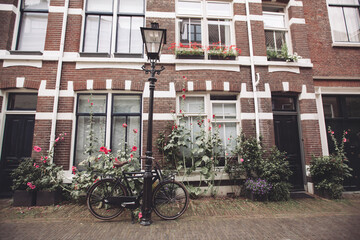 Fototapeta na wymiar beautiful architecture house facade and bicycle on the streets of the city of Utrecht in the Netherlands.