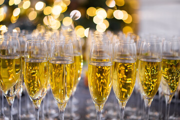 many glasses filled with champagne in celebration of the new year