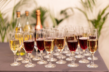 many glasses of wine on the table buffet