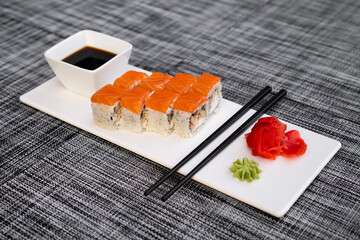 a dish of delicious sushi rolls