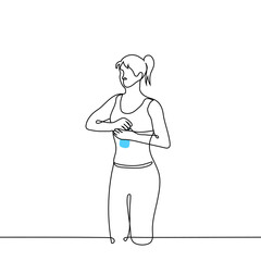 young woman in sports top and leggings opens a bottle of water - one line drawing vector. concept to quench thirst during training, replenish the water balance in the body